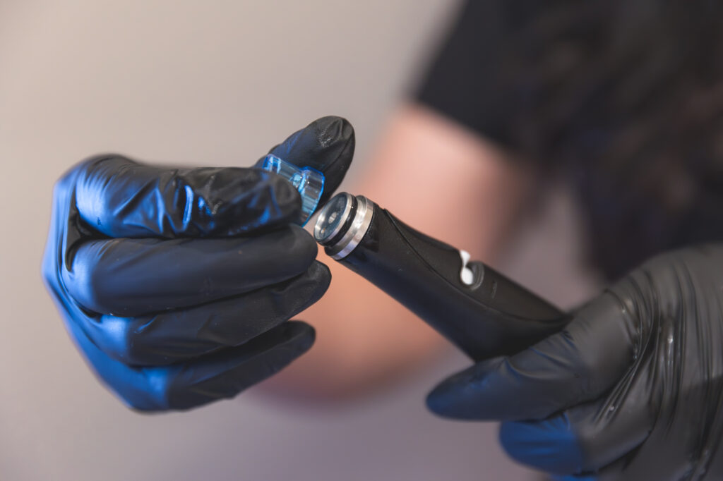 Aesthetic technician holding a HydraFacial device at Park Place Medical Spa in Granger, IN, preparing for a skin rejuvenation treatment