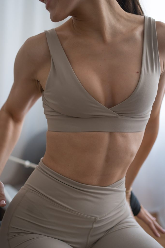 Woman in tan colored top and bottoms